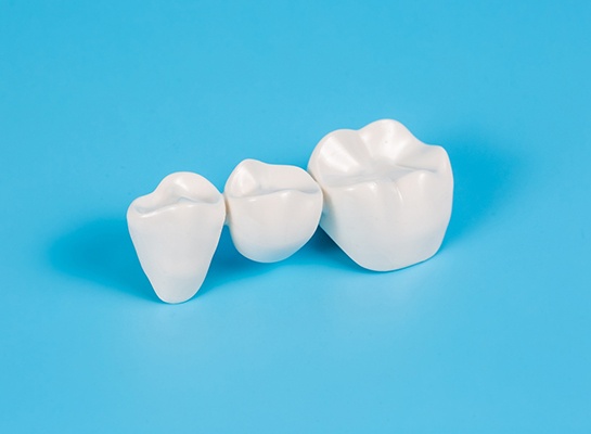 Closeup of dental bridge with blue background