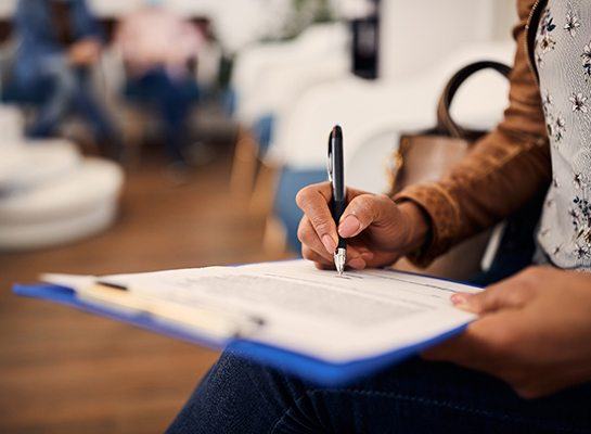 Patient filling out form in lobby