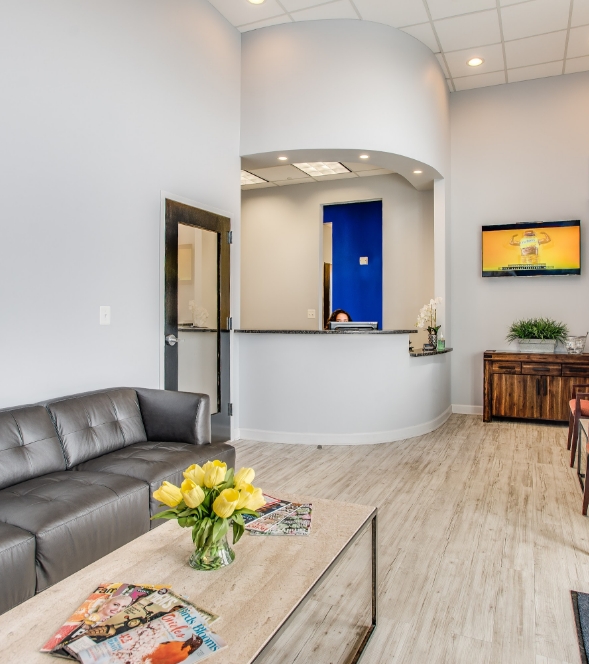 Three smiling White Marsh dentists at Dental Designs of Maryland
