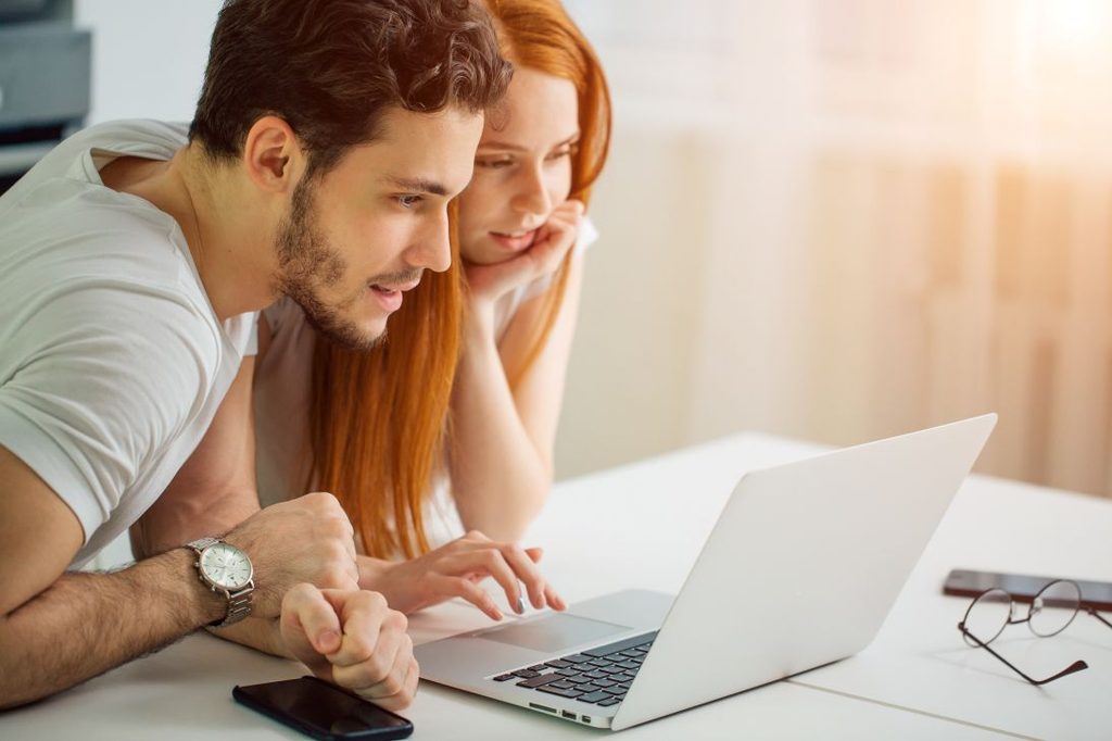 A couple looking at dental insurance plans online